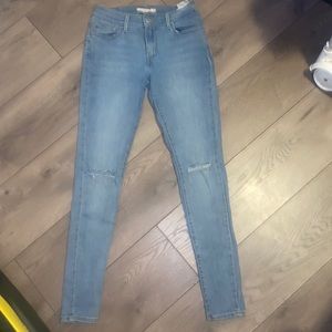 710 super skinny (size 28) Levi’s jeans with rips on the knees